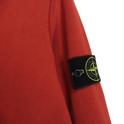 Stone Island red cotton sweatshirt with logo badge and ribbed cuffs.