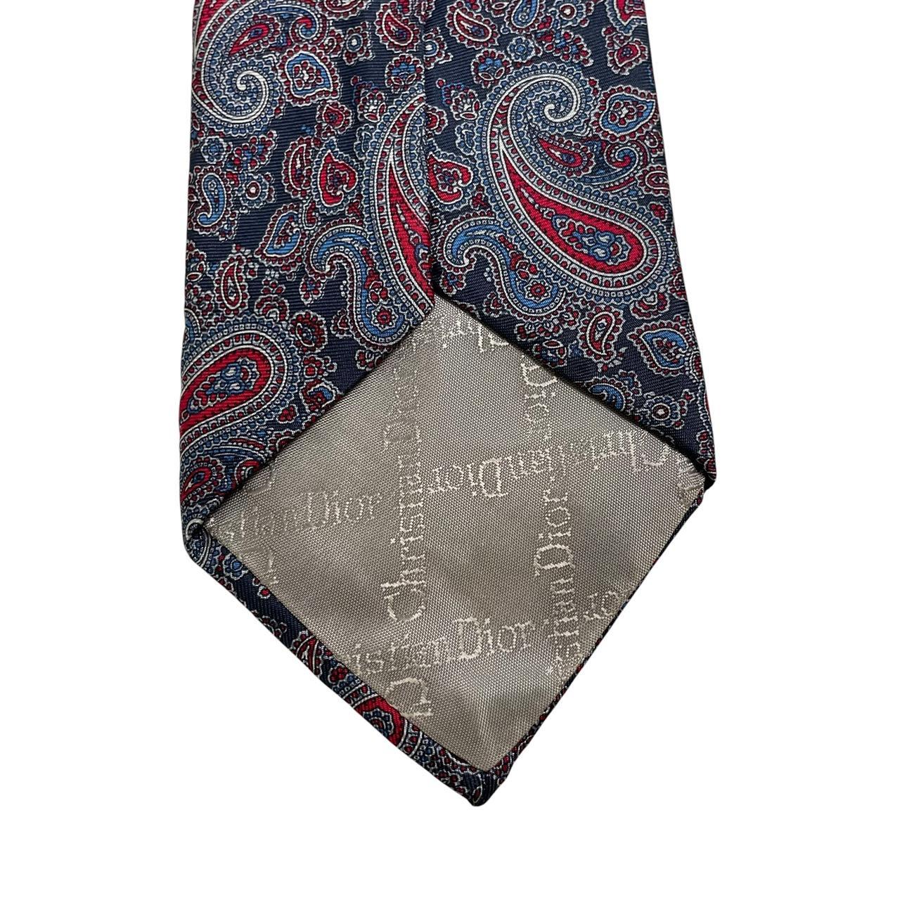 Christian Dior multicoloured paisley silk tie with intricate pattern and smooth texture.