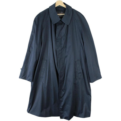 Christian Dior navy blue trench coat, single-breasted, vintage 90s style, classic design.
