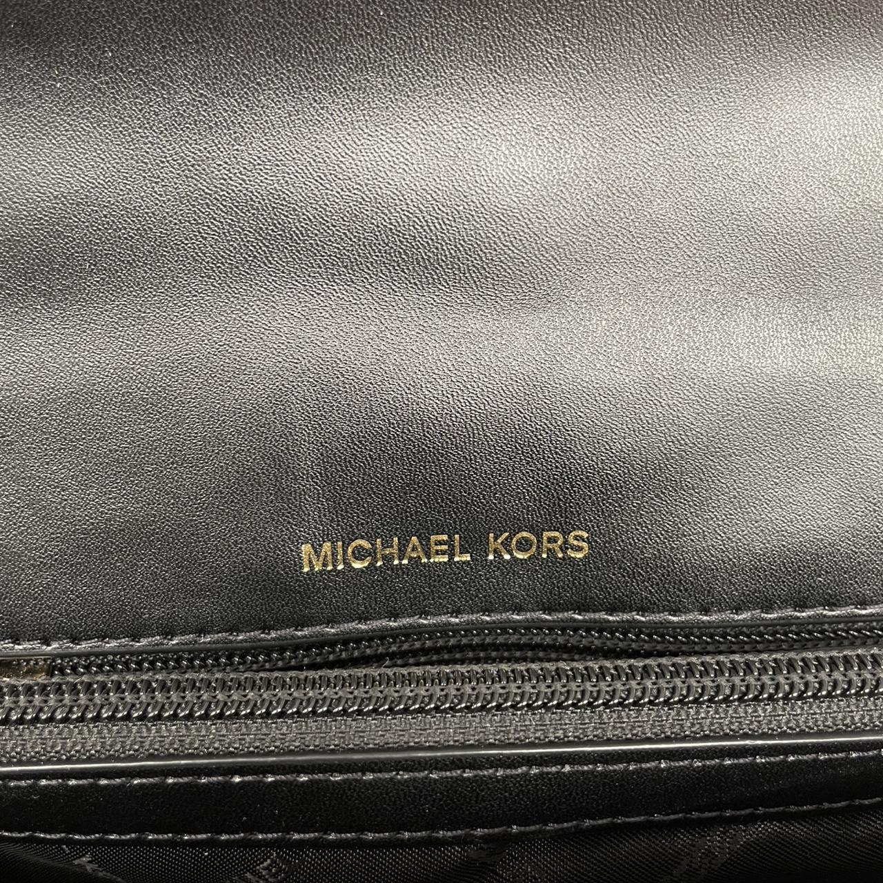 Michael Kors black duffel bag with quilted pattern and logo detail, pre-loved condition.