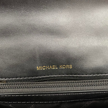 Michael Kors black duffel bag with quilted pattern and logo detail, pre-loved condition.