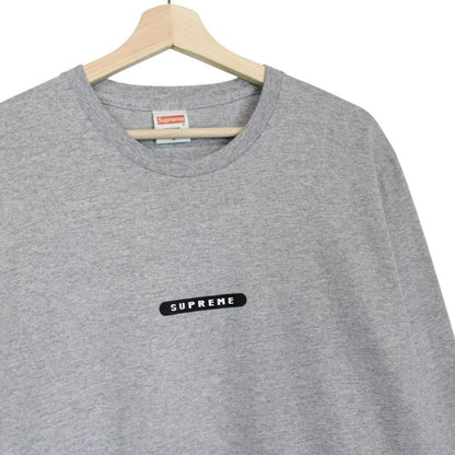Supreme grey and pink long sleeve cotton t-shirt with wild print and pocket detail.