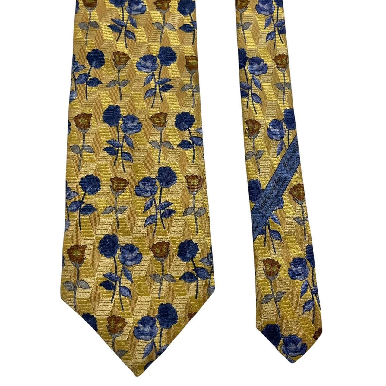 Ermenegildo Zegna yellow silk tie with floral pattern and logo detail.