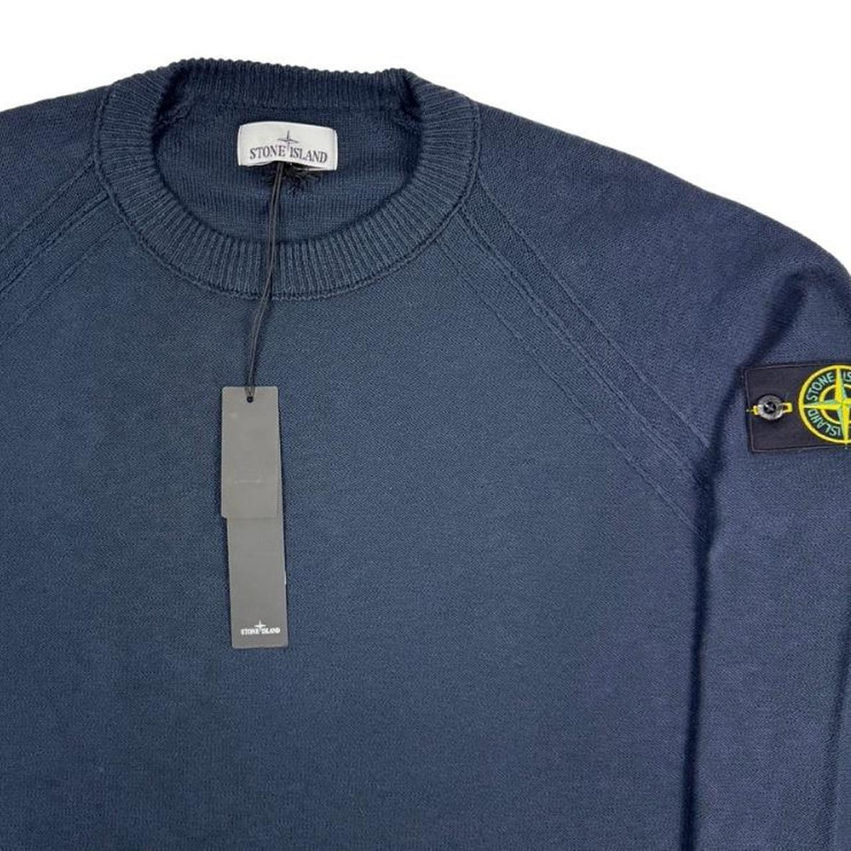 Stone Island navy blue knit jumper with micro stitch detailing and logo patch.