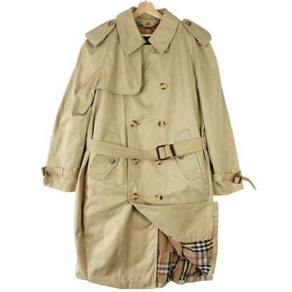 Burberry beige trench coat with Nova Check pattern, double breasted and belted design.