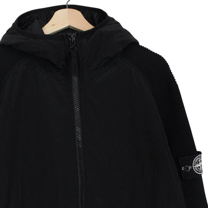 Stone Island black jacket with special process badge and full zip design.