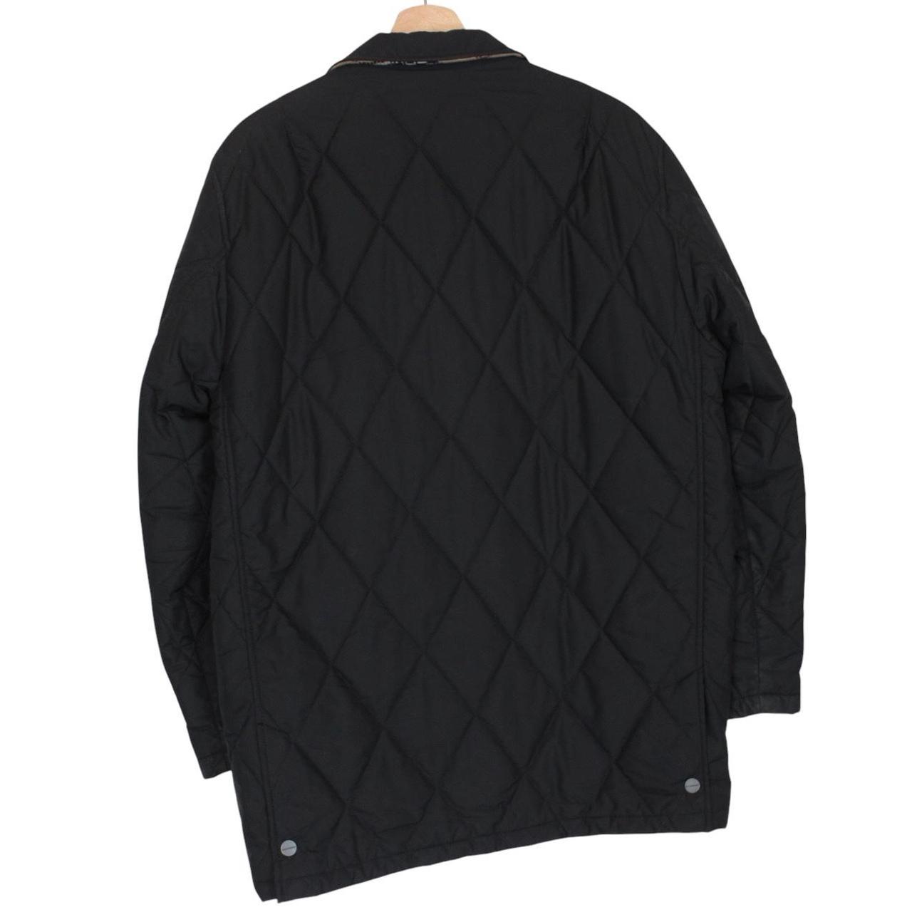 Burberry black coat with Nova Check lining and diamond quilted pattern.