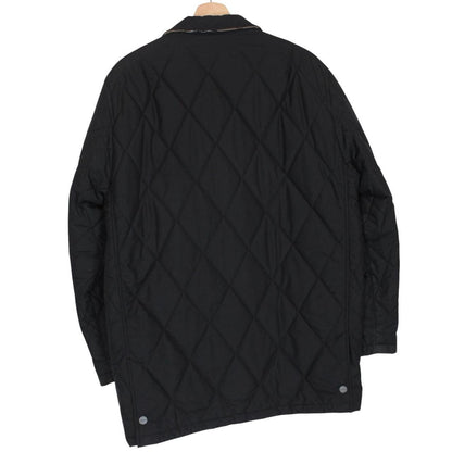 Burberry black coat with Nova Check lining and diamond quilted pattern.