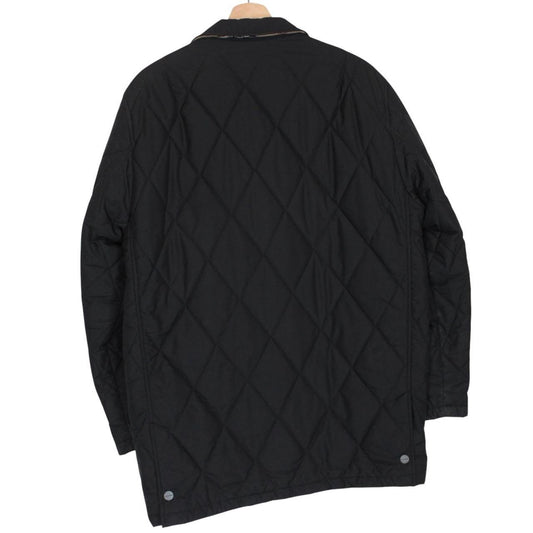 Burberry black coat with Nova Check lining and diamond quilted pattern.