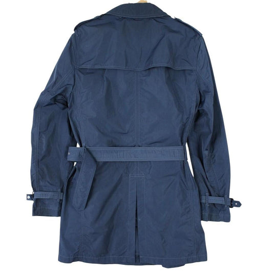 Burberry blue trench coat with Nova Check lining and belted double-breasted design.