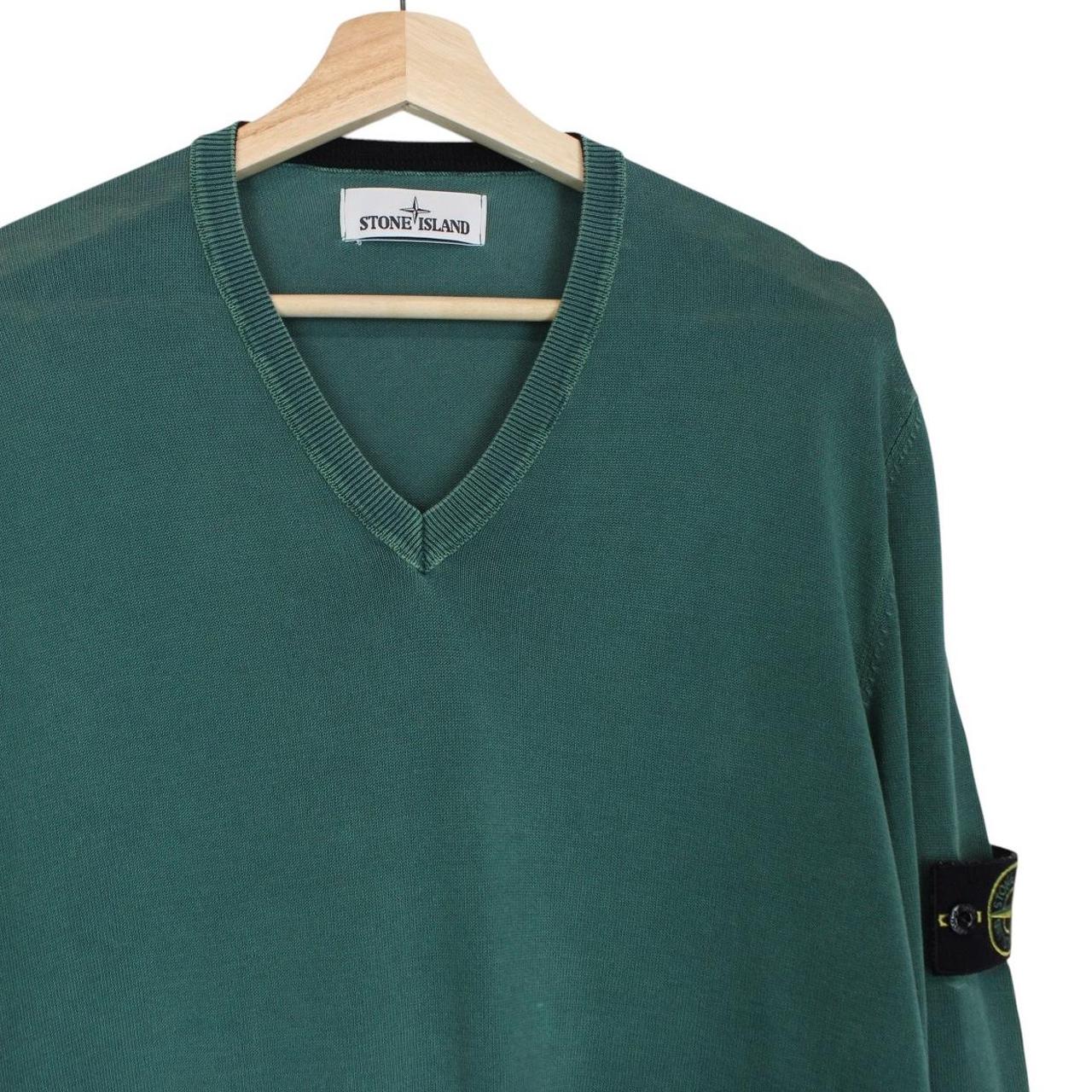 Stone Island green knit v-neck jumper with logo patch on sleeve and ribbed cuffs.