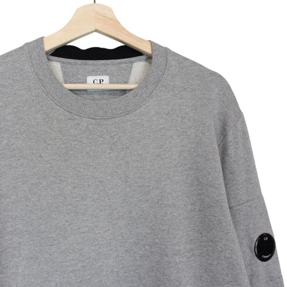 CP Company grey sweatshirt with lens detail and cotton material.