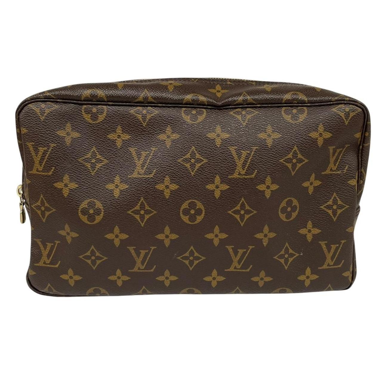 Louis Vuitton brown and tan monogram toiletry pouch with iconic logo and canvas material.