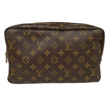 Louis Vuitton brown and tan monogram toiletry pouch with iconic logo and canvas material.