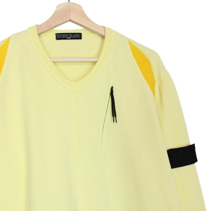 Stone Island yellow v-neck sweatshirt with logo patch and soft cotton material.