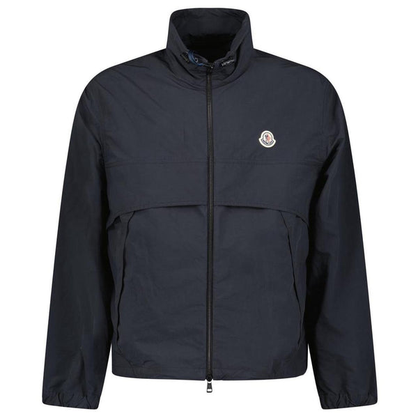 Moncler black windbreaker jacket with full zip, logo patch on sleeve, lightweight material.