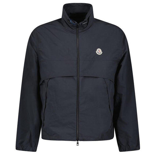 Moncler black windbreaker jacket with full zip, logo patch on sleeve, lightweight material.