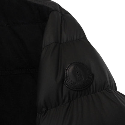 Moncler black suede leather down jacket with full zip and missing badge detail.