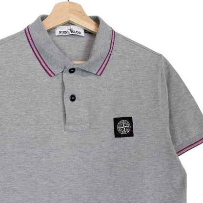 Stone Island grey polo shirt with embroidered compass logo and cotton material.