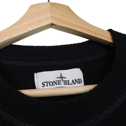 Stone Island black knit jumper with logo badge and cotton/nylon blend material.