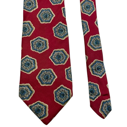 Christian Dior red silk tie with geometric pattern and logo detail.