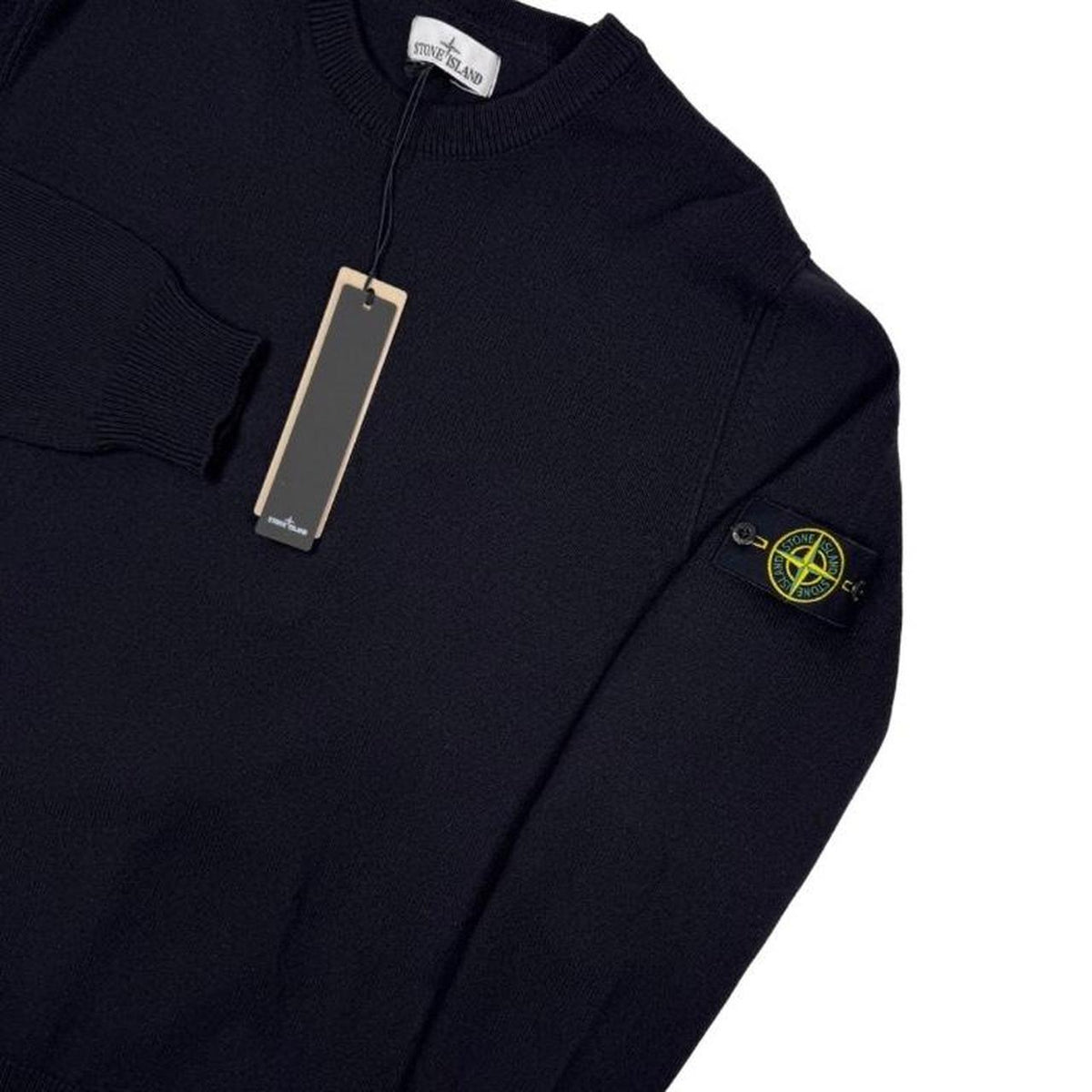 Stone Island black knit jumper with logo patch and organic cotton material.