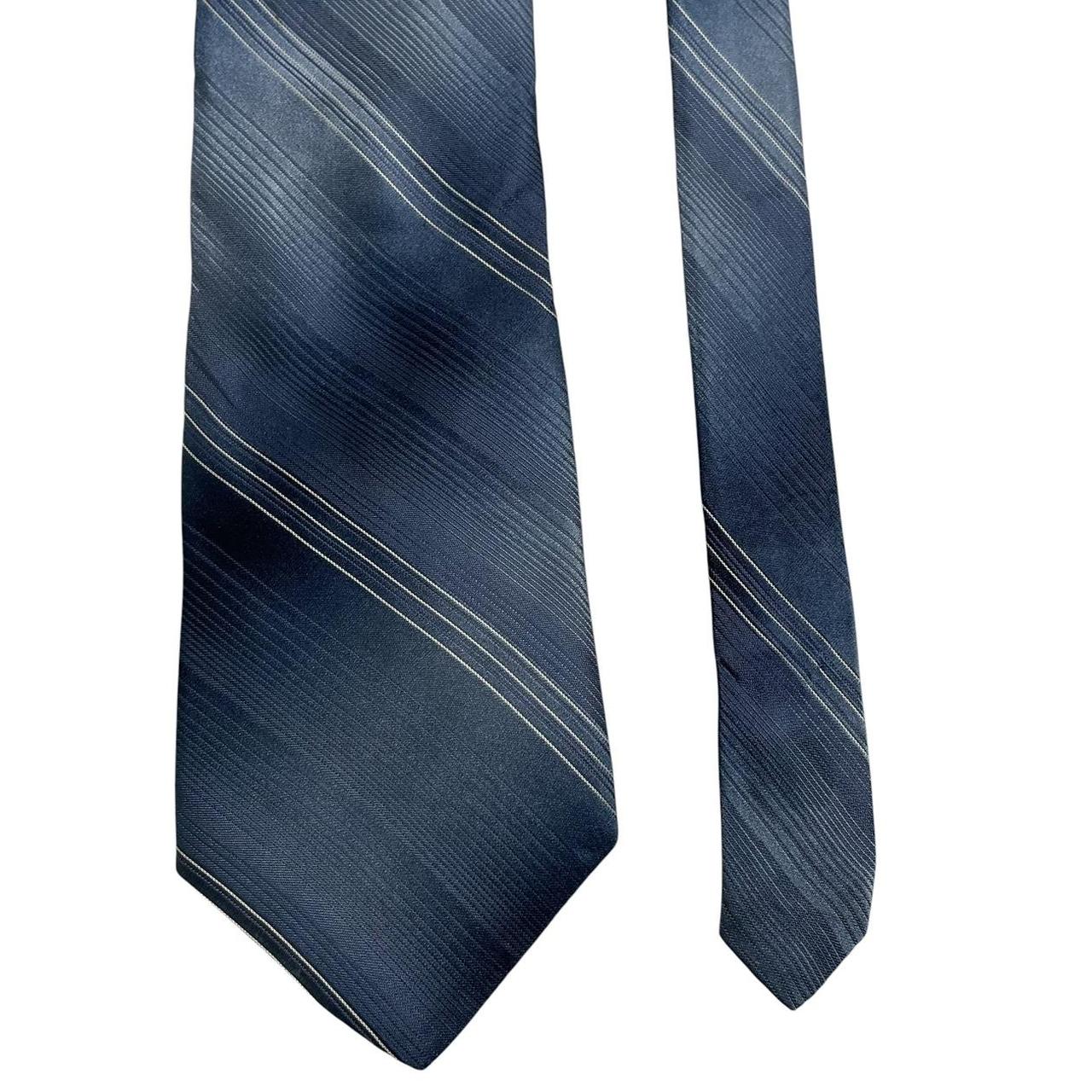 DKNY blue striped silk tie with elegant sheen and classic pattern.