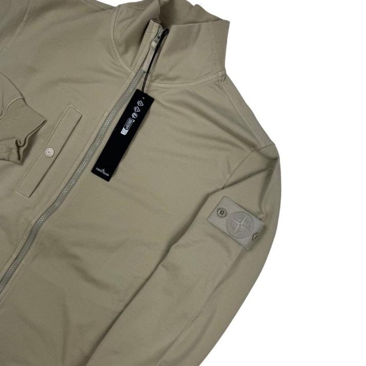 Stone Island beige full zip sweatshirt with ghost logo and cotton material.