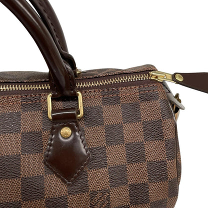 Louis Vuitton brown Damier Ebene canvas handbag with gold hardware and padlock detail.