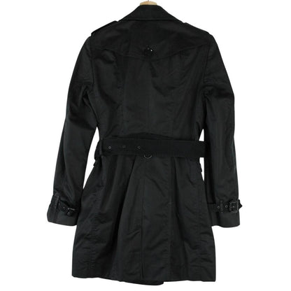 Burberry black double breasted belted trench coat with logo detailing and classic design.