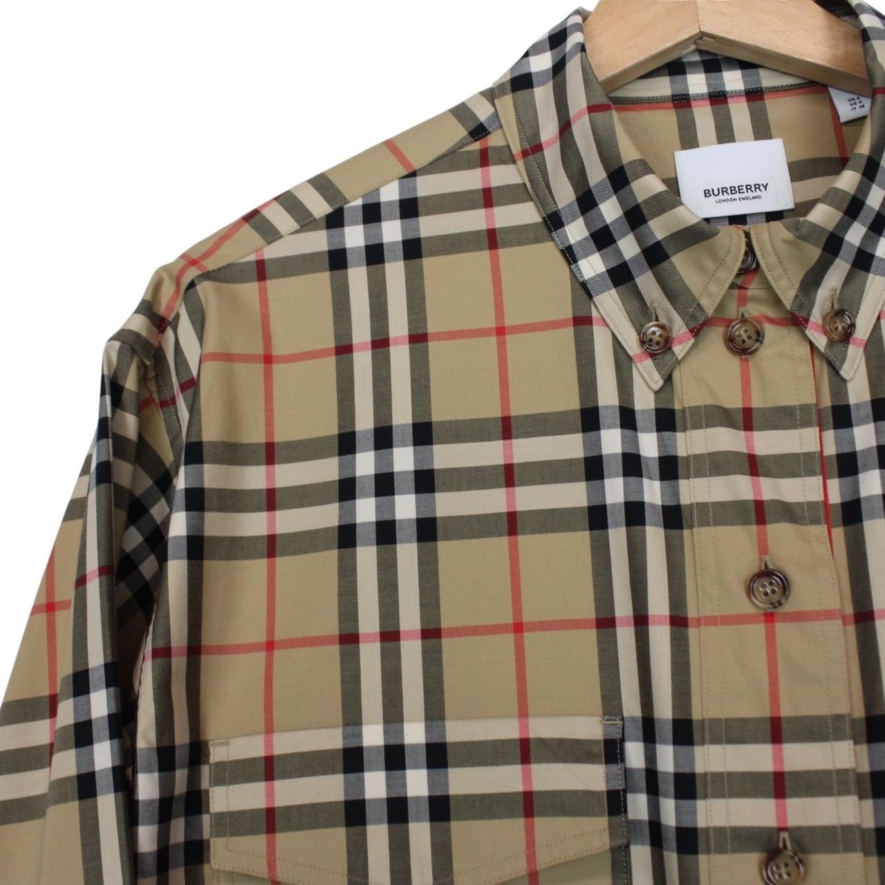 Burberry tan brown long sleeve shirt with Nova Check pattern and logo detail.