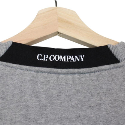CP Company grey sweatshirt with lens detail and cotton material.
