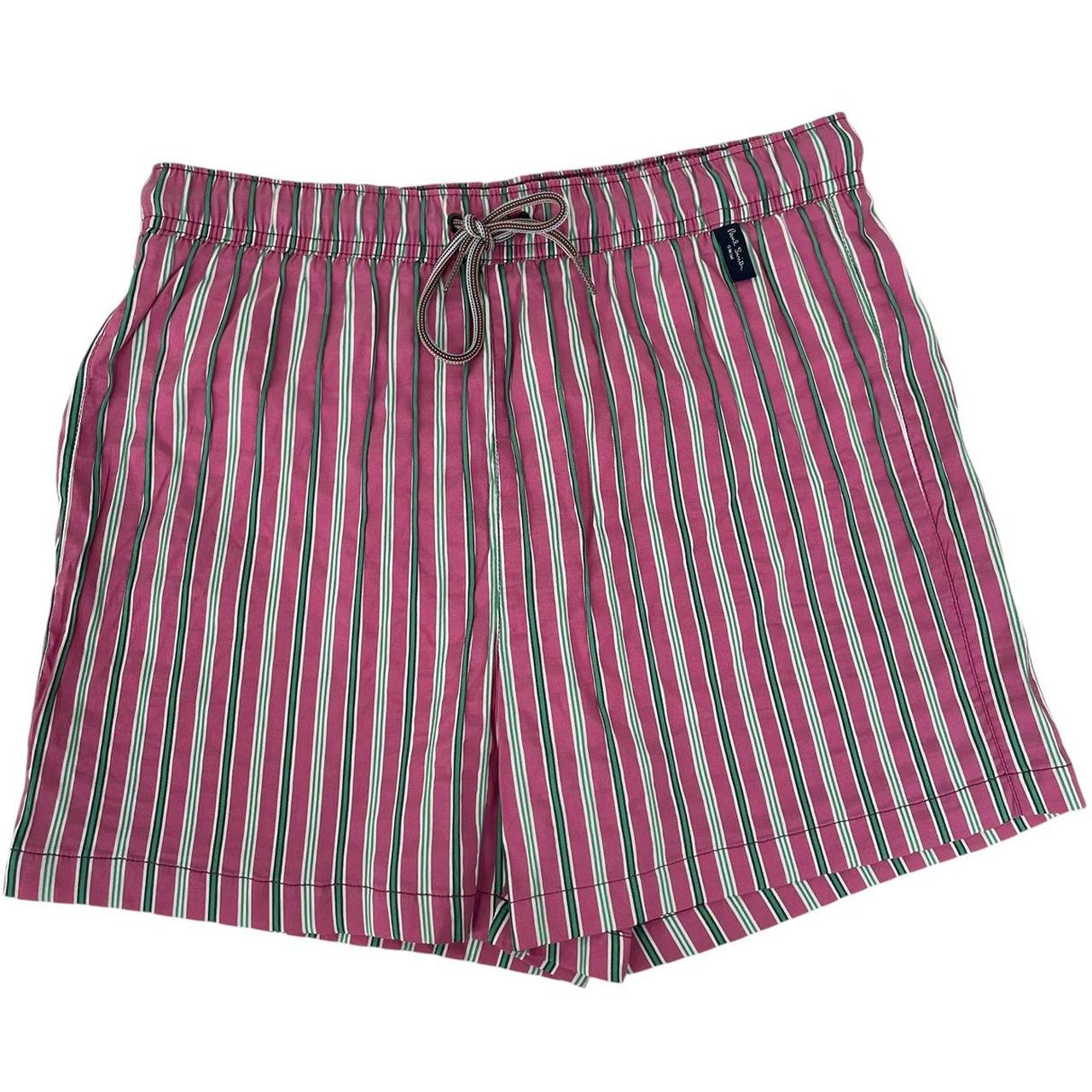 Paul Smith red swim shorts with striped pattern and cotton material.