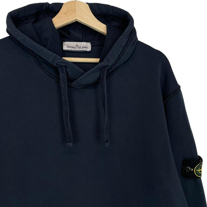 Stone Island navy blue cotton hoodie with iconic compass logo on sleeve.