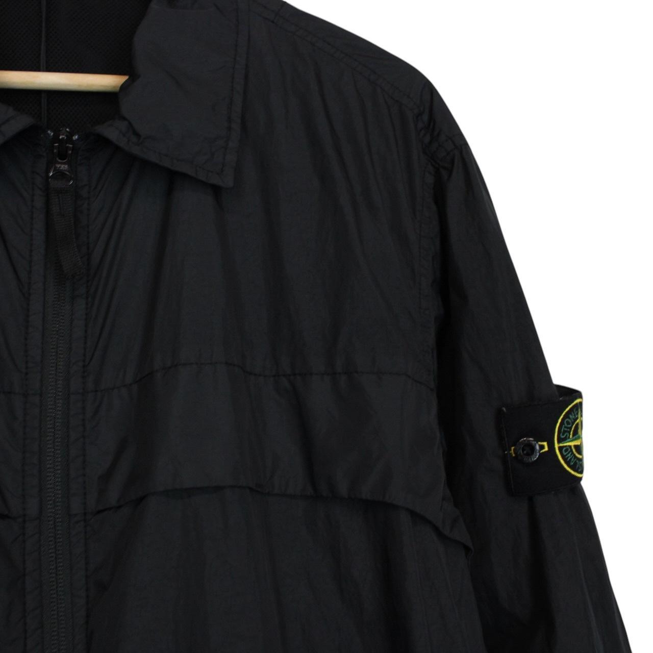 Stone Island black overshirt jacket with full zip, two zipped pockets, and snap button cuffs.