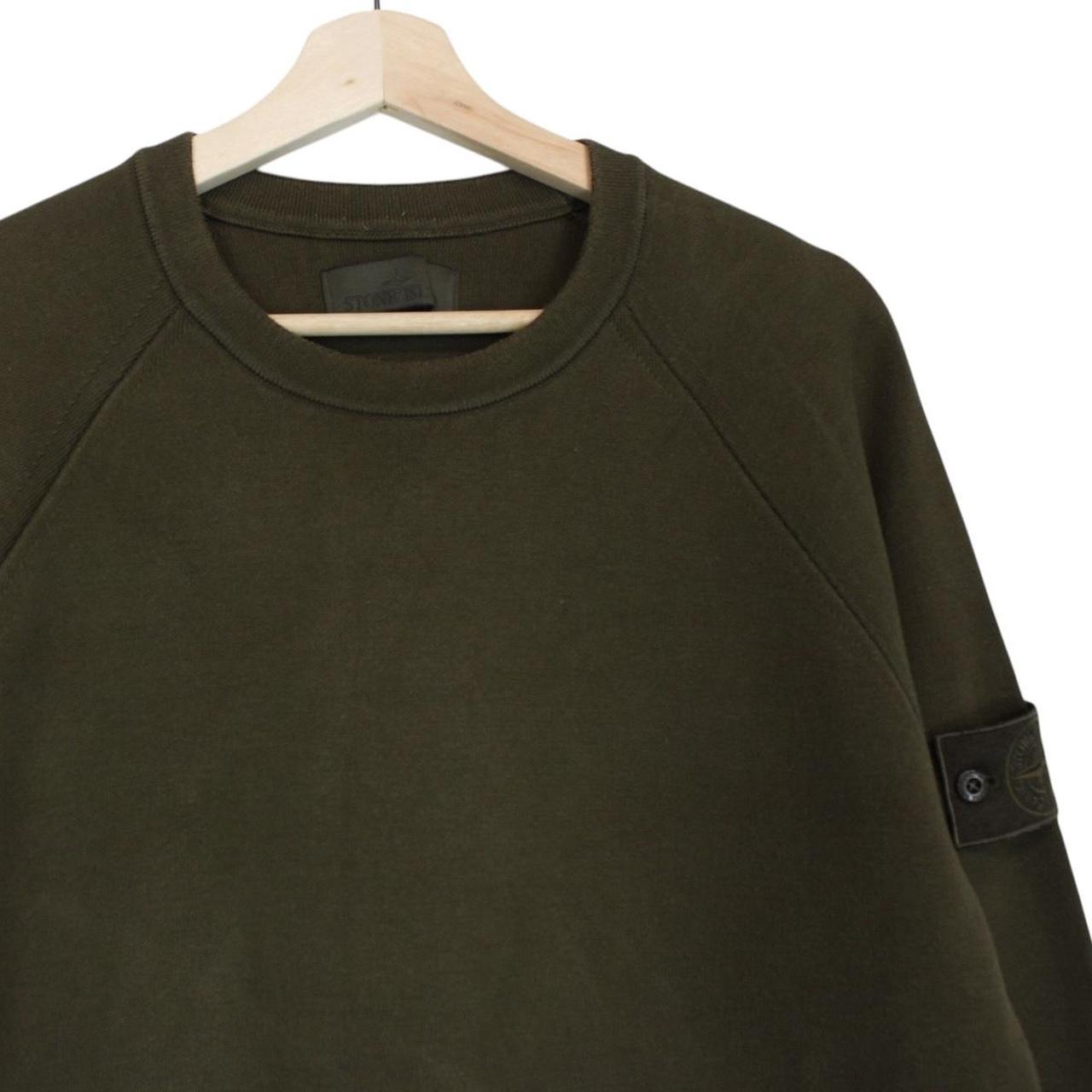 Stone Island khaki green sweatshirt with ghost logo and soft cotton material.