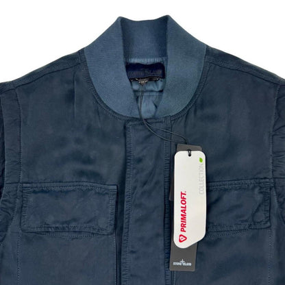 Stone Island navy blue vest jacket with logo patch and Primaloft material.