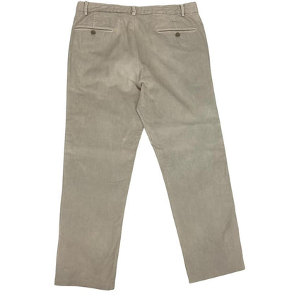 CP Company beige ribbed cotton trousers with faint stains and regular fit design.