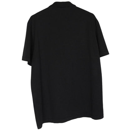 Stone Island black polo shirt with embroidered compass logo and cotton material.