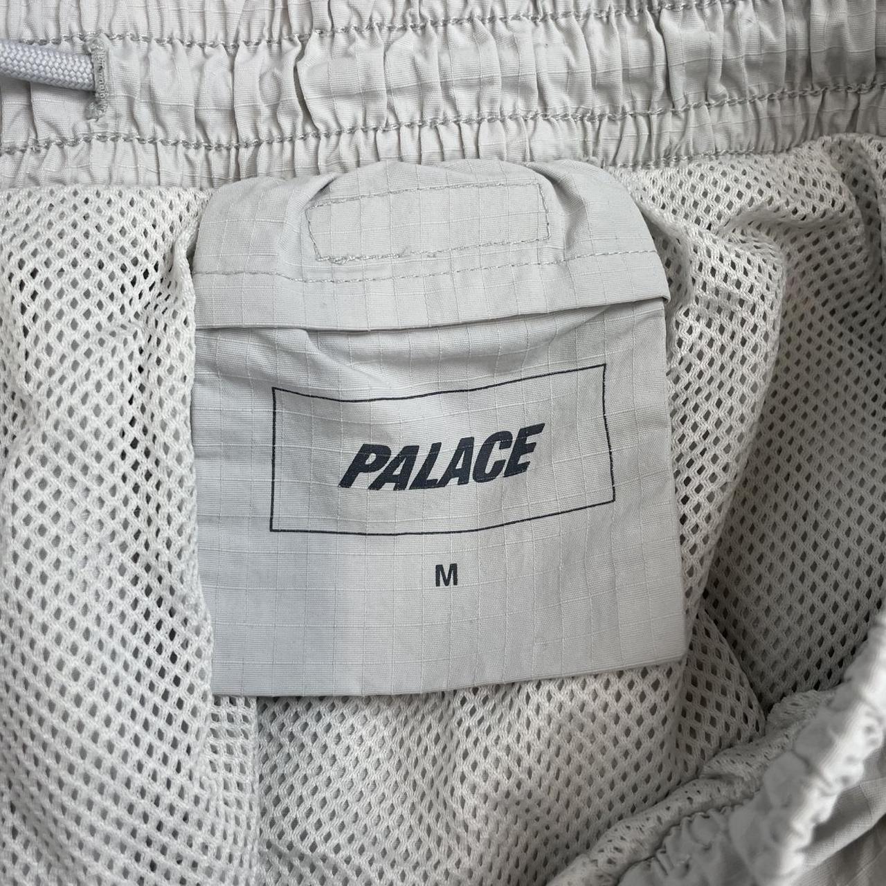 Palace grey joggers embroidered dragon design, made of nylon, size medium.