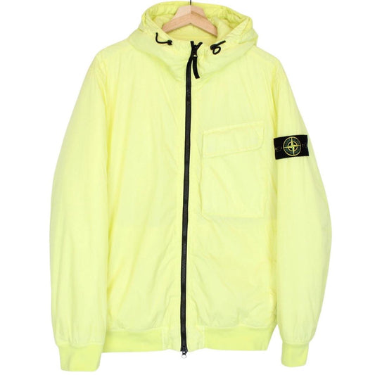 Stone Island yellow jacket with crinkle texture and logo badge on sleeve.