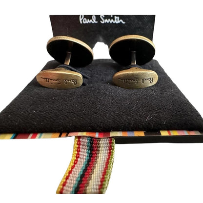Paul Smith gunmetal cufflinks 2D spider design with intricate detailing and brand logo.