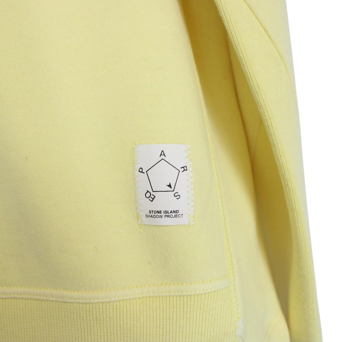 Stone Island yellow v-neck sweatshirt with logo patch and soft cotton material.
