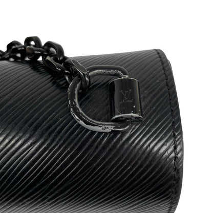 Louis Vuitton black Epi leather duffel bag with twist lock and visible wear.