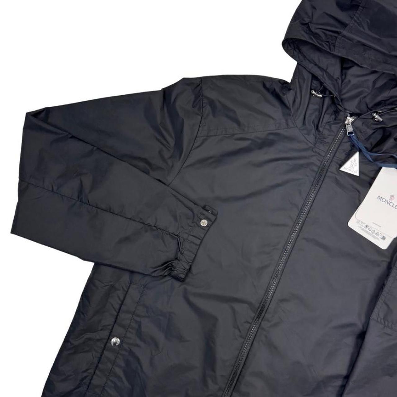 Moncler black windbreaker jacket, full zip, hooded, nylon material, logo on chest.