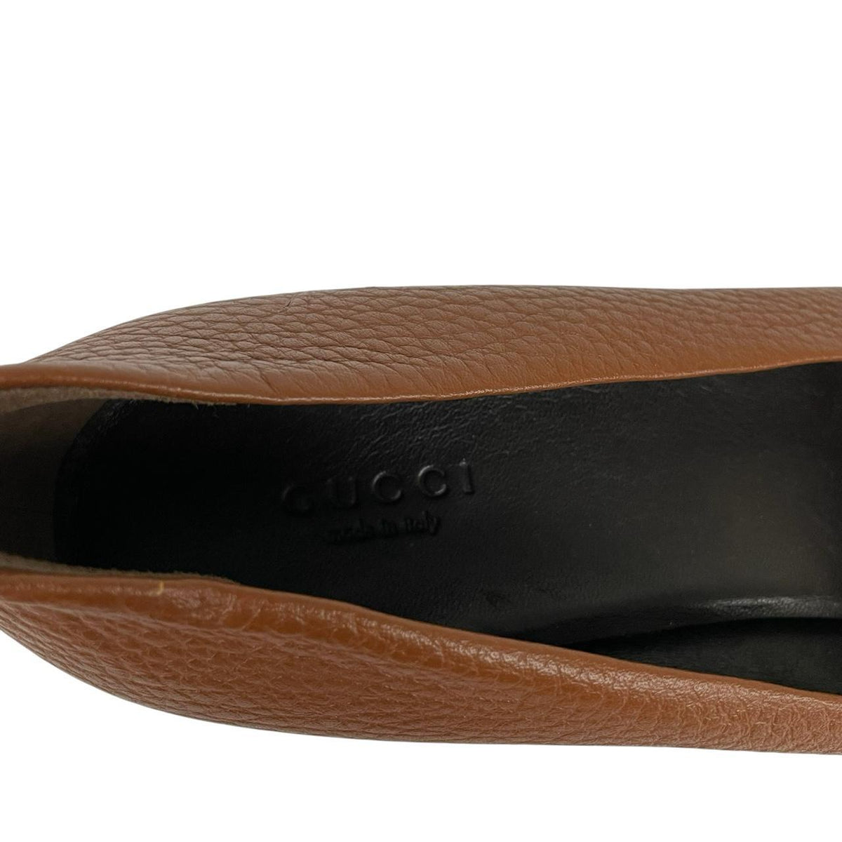 Gucci brown high heels with pebbled leather and interlocking G buckle detail.