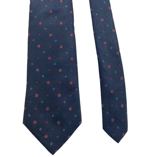 Yves Saint Laurent navy blue silk tie with subtle sheen and classic design.