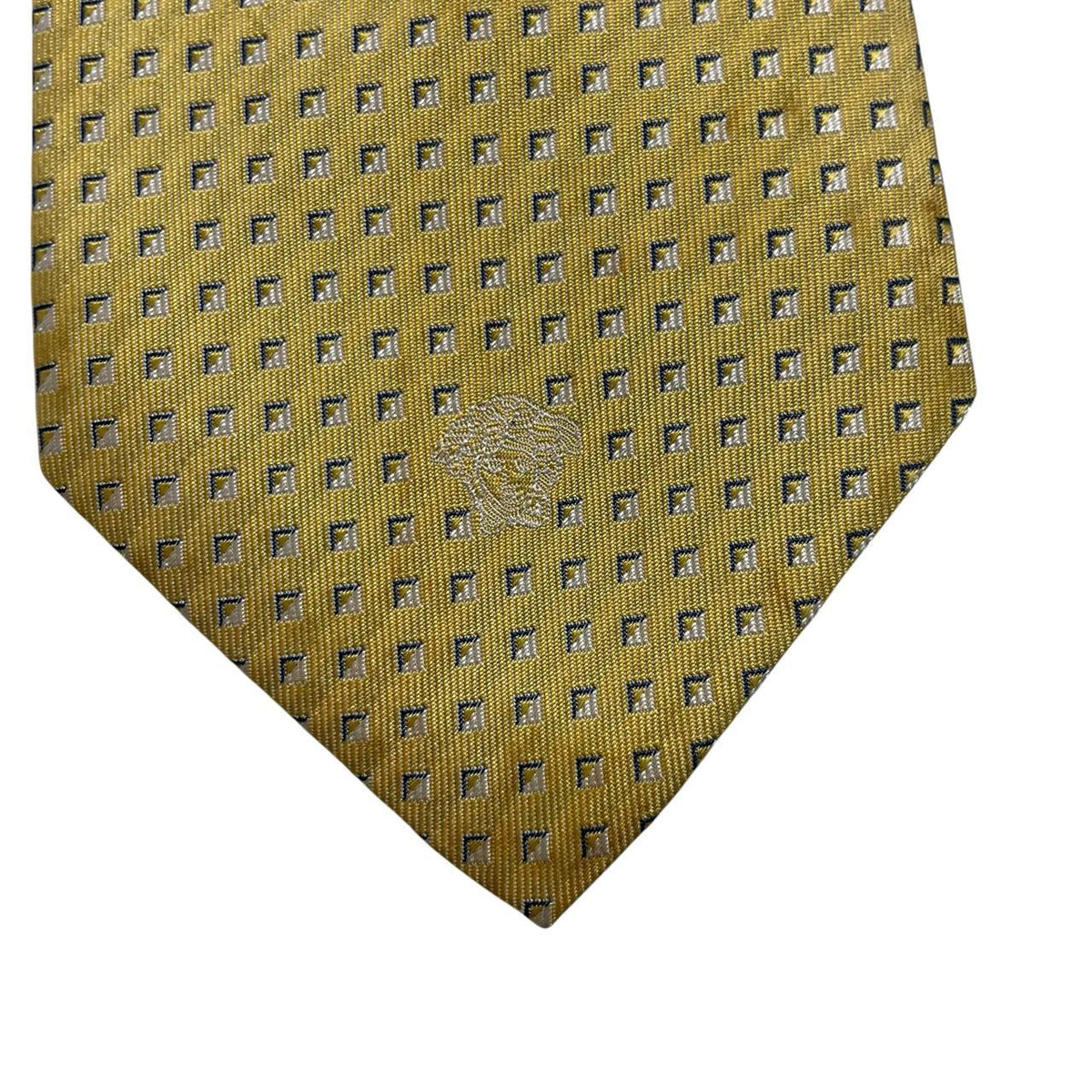 Versace yellow silk tie with subtle pattern and faint mark on front.