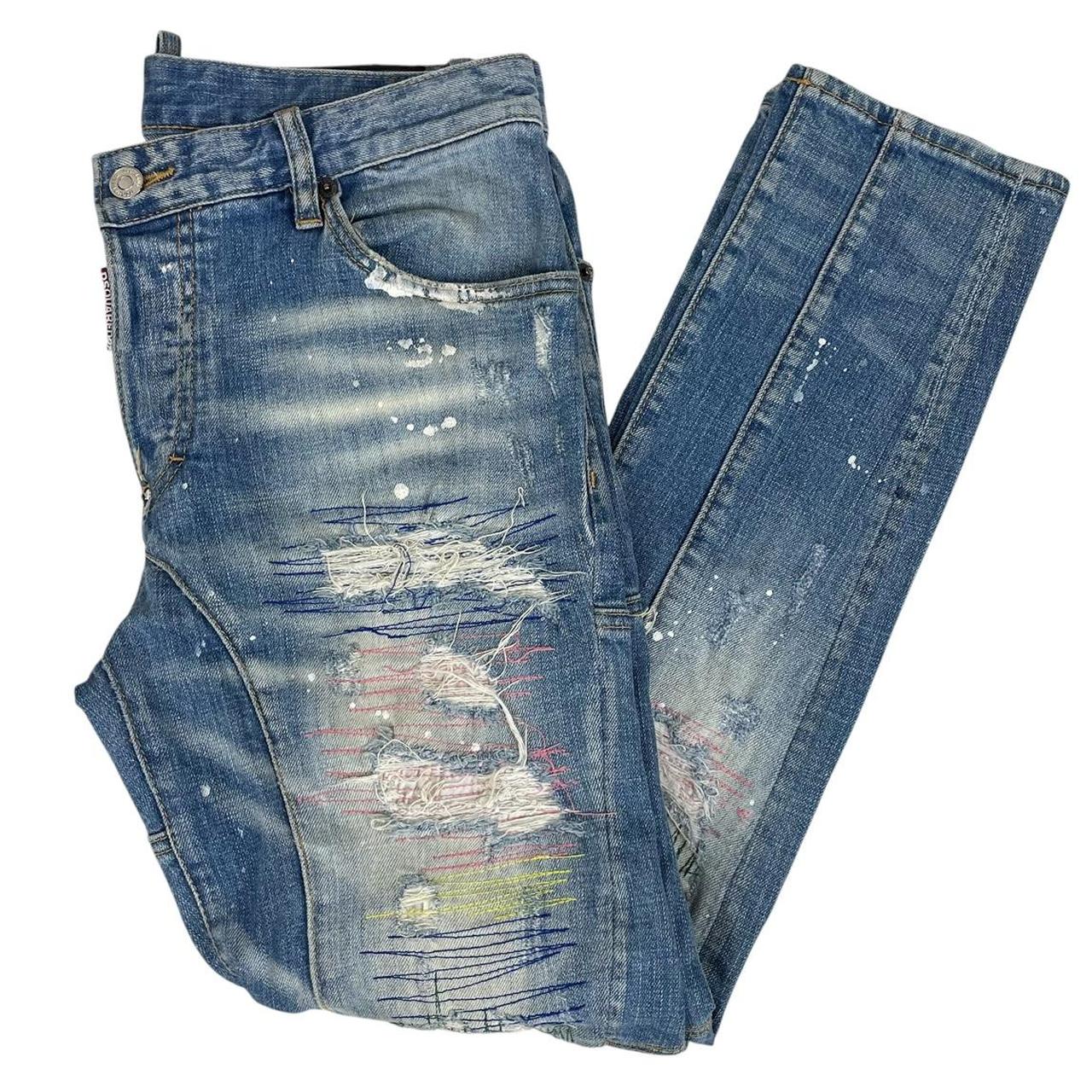 Dsquared2 blue straight jeans with distressed details and logo patch on back pocket.
