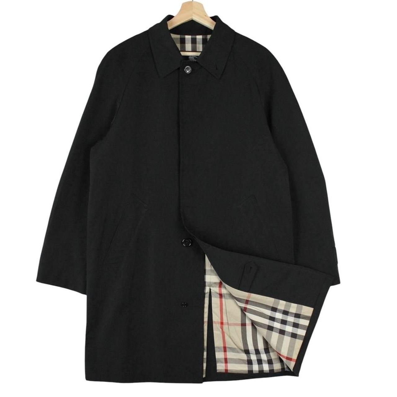 Burberry black Balmacaan coat with Nova Check lining and logo detail.